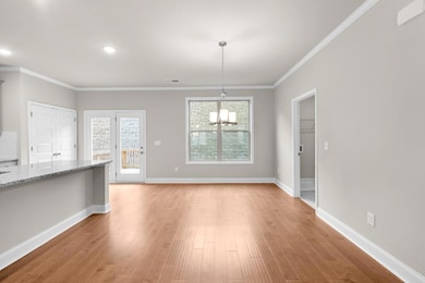 Unfurnished dining area featuring an inviting chan