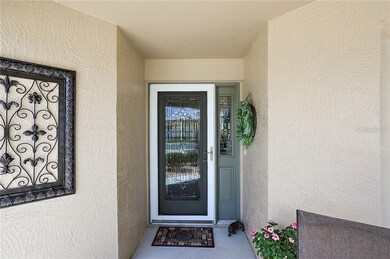 Front entrance with storm door and elegant leaded 