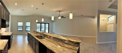 LOOKING THROUGH KITCHEN TO DINING NOOK AT 2906 SE 8TH AVE