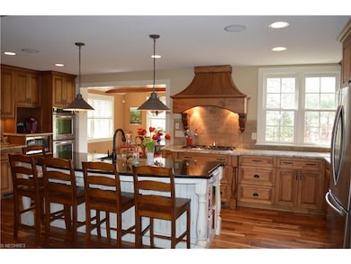 Large kitchen with granite counter-tops, custom wo