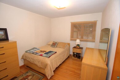 Bedroom with light wood finished floors