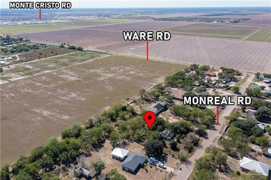 Aerial view of sparsely populated area featuring farmland