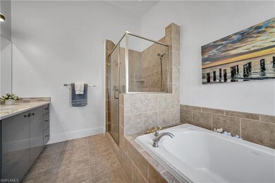 Bathroom featuring vanity, tile patterned flooring