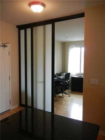Office/Den with custom doors and large window make