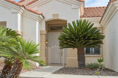 Property entrance with a tile roof, stucco siding,