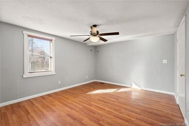 Main bedroom w/ attached half bath