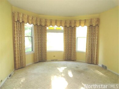 Big windows with views of front yard and Carlton A