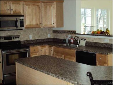 Kitchen kitchen showing breakfast bar, maple wood 