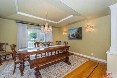 Formal dining room with chandelier and coffered ce