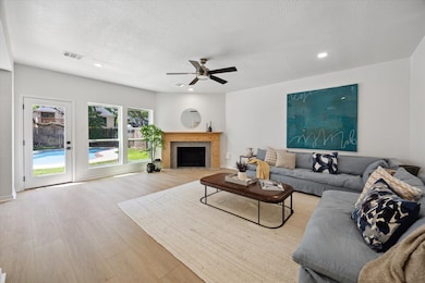 The updated fireplace anchors the inviting family