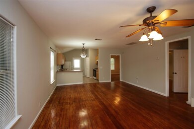Unfurnished living room featuring hardwood / wood