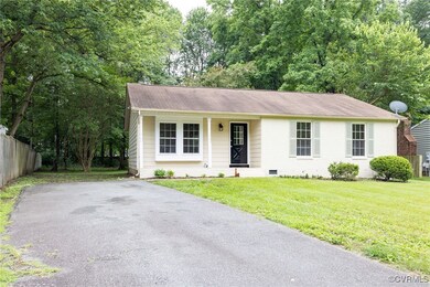 Ranch-style house with a shingled roof