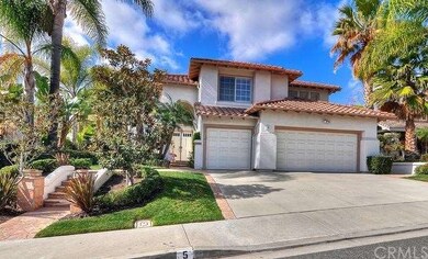 Home boasts stone-accented walkway and a 3-car gar