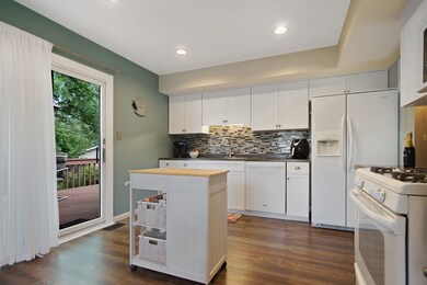 Pour your glass of wine and walk out of kitchen to