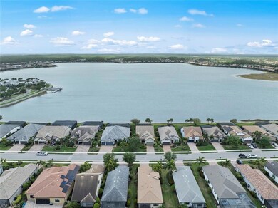 Drone / aerial view with a residential view and a water view