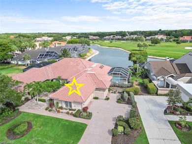 Aerial view of residential area with a large body of water and a golf club