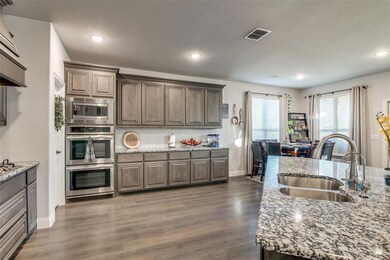 Open kitchen with breakfast area