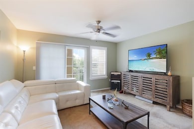Living room with custom window coverings.