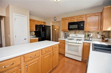 Note the Tile Backsplash, New Hardware and Light Fixtures, and Plenty of Counter Space!