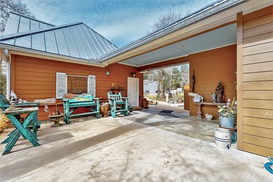 Covered walkway between the detached garage and side entry to the home