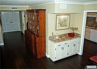 View showing front door, entry hall, dining bar si