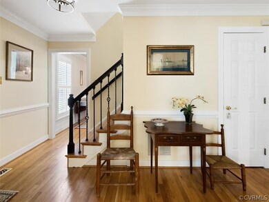 View of the Foyer, with beautiful hardwoods and a