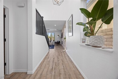 Corridor featuring baseboards and wood finished fl