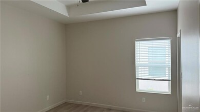 Empty room featuring wood-type flooring and ceiling fan