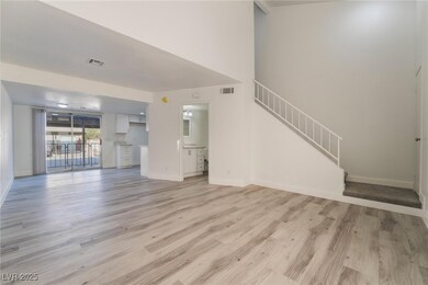 Unfurnished living room featuring baseboards, visi