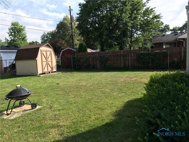 All fenced yard with shed for extra storage.