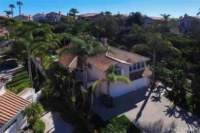 Another aerial view of the property and home