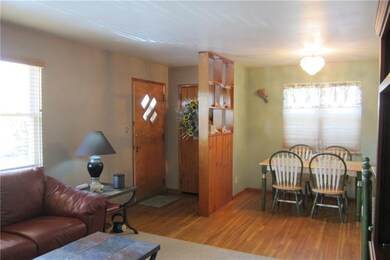 View of entry and dining area.  Note the hardwood 
