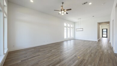 Spare room with ceiling fan, healthy amount of na