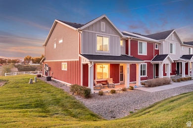 View of front of home featuring board and batten siding, a porch, roof mounted solar panels, and a shingled roof