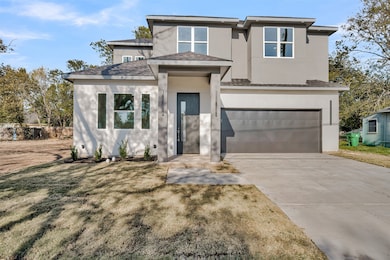 Prairie-style house featuring stucco siding, a garage, driveway, and roof with shingles