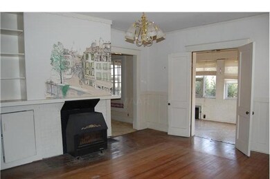 Another view of dining room with original hardwood