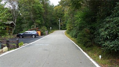 Flat section of Clawson Drive.  Lot for sale is ju