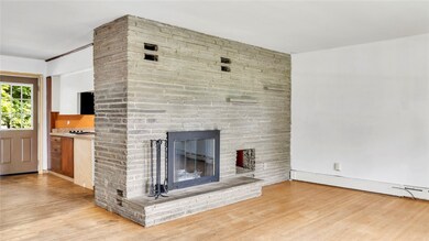 The Living room with hardwood floors open to the d