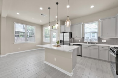 Spacious kitchen and dining combo with large windo