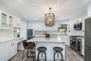Spacious Island with ample seating. Wine fridge.