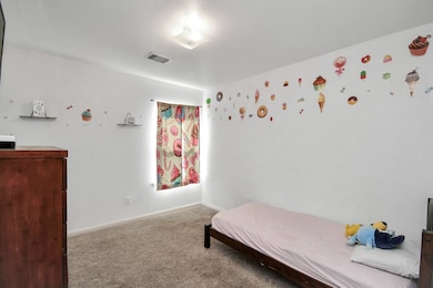 This cozy kid’s bedroom, set up with a twin bed, h