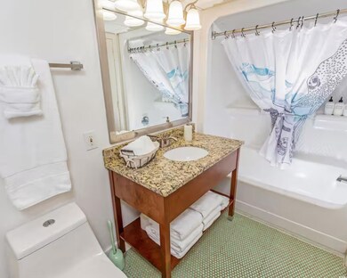 Full bath with vanity and shower / bath combination with curtain