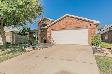 View of front facade with a garage and a front yar