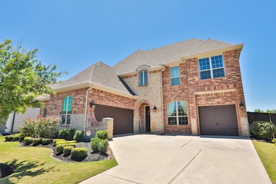 Beautiful landscaping and stone accent the front o