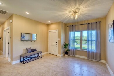 Sitting room featuring visible vents, baseboards,