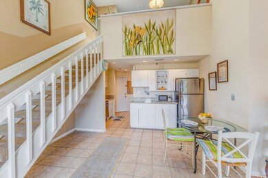 Kitchen with white microwave, freestanding refrige