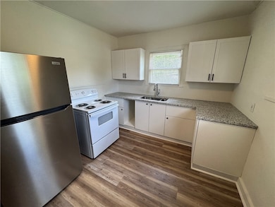 Kitchen featuring freestanding refrigerator, elect