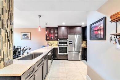 Side view of part kitchen, quartz countertops, sta