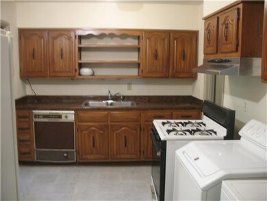 Cozy kitchen that consists of a stove, refrigerato