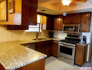 Kitchen features granite counter tops w/new underm
